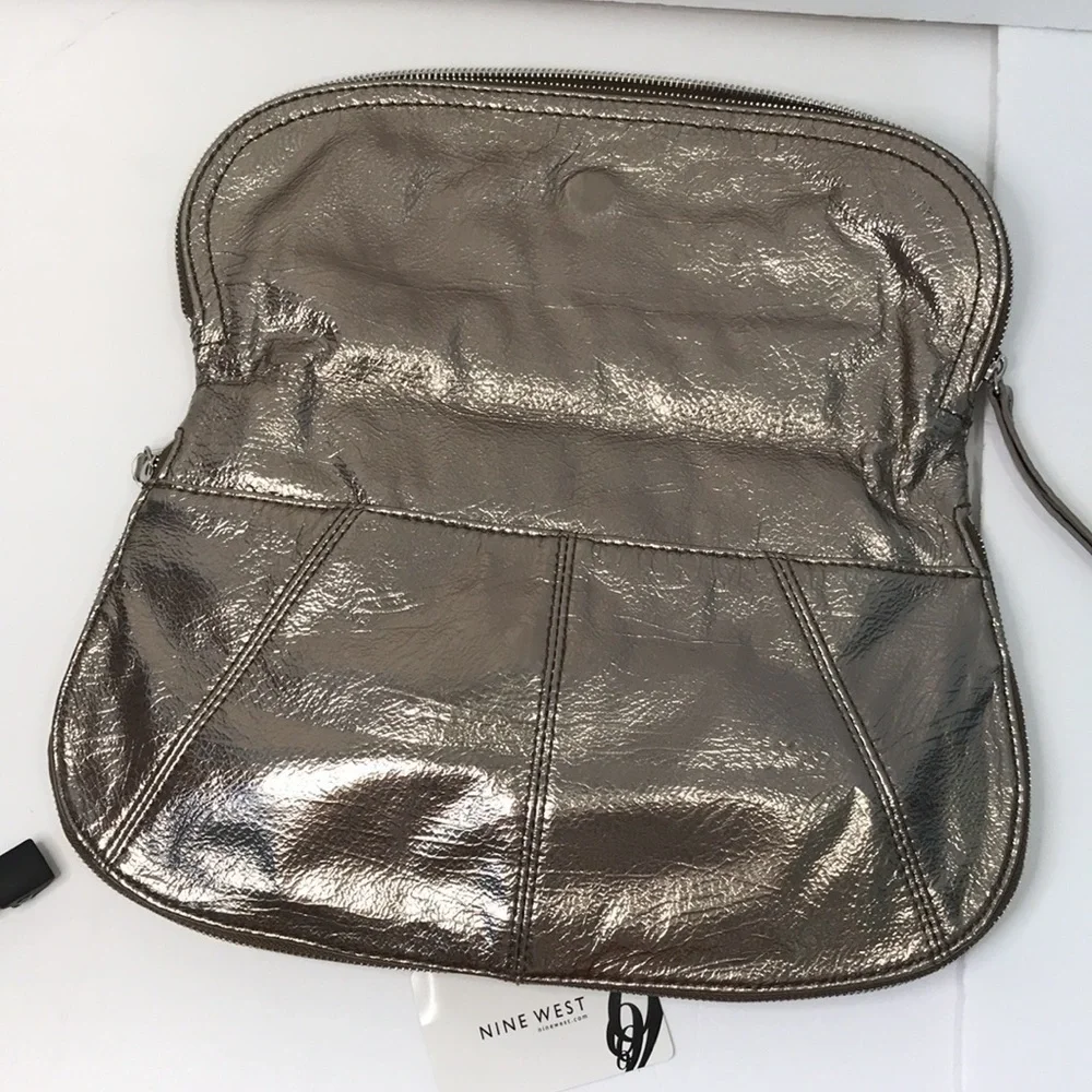 Price is firm NINE WEST Metallic Silver Zip Magnet Fold Clutch